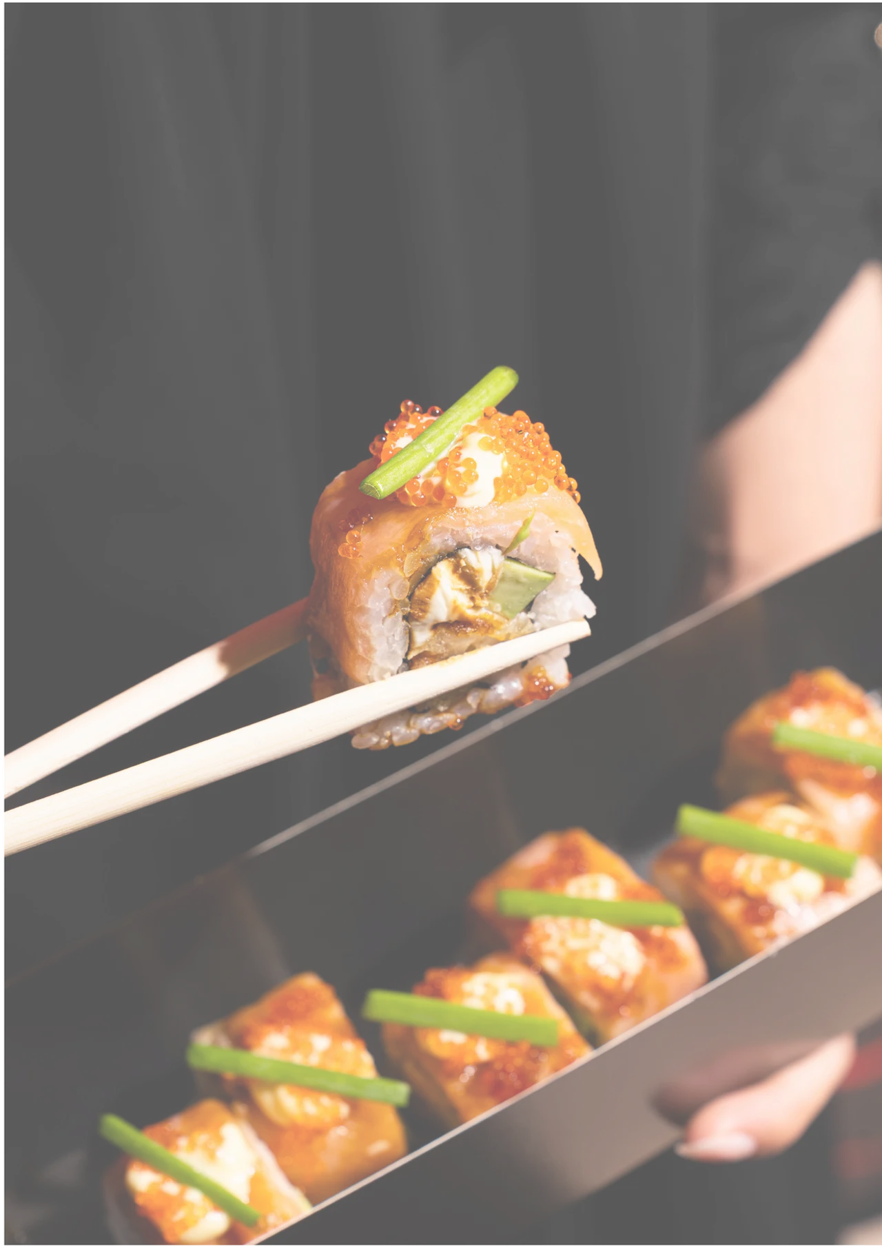 Okashi sushi presented with chopsticks